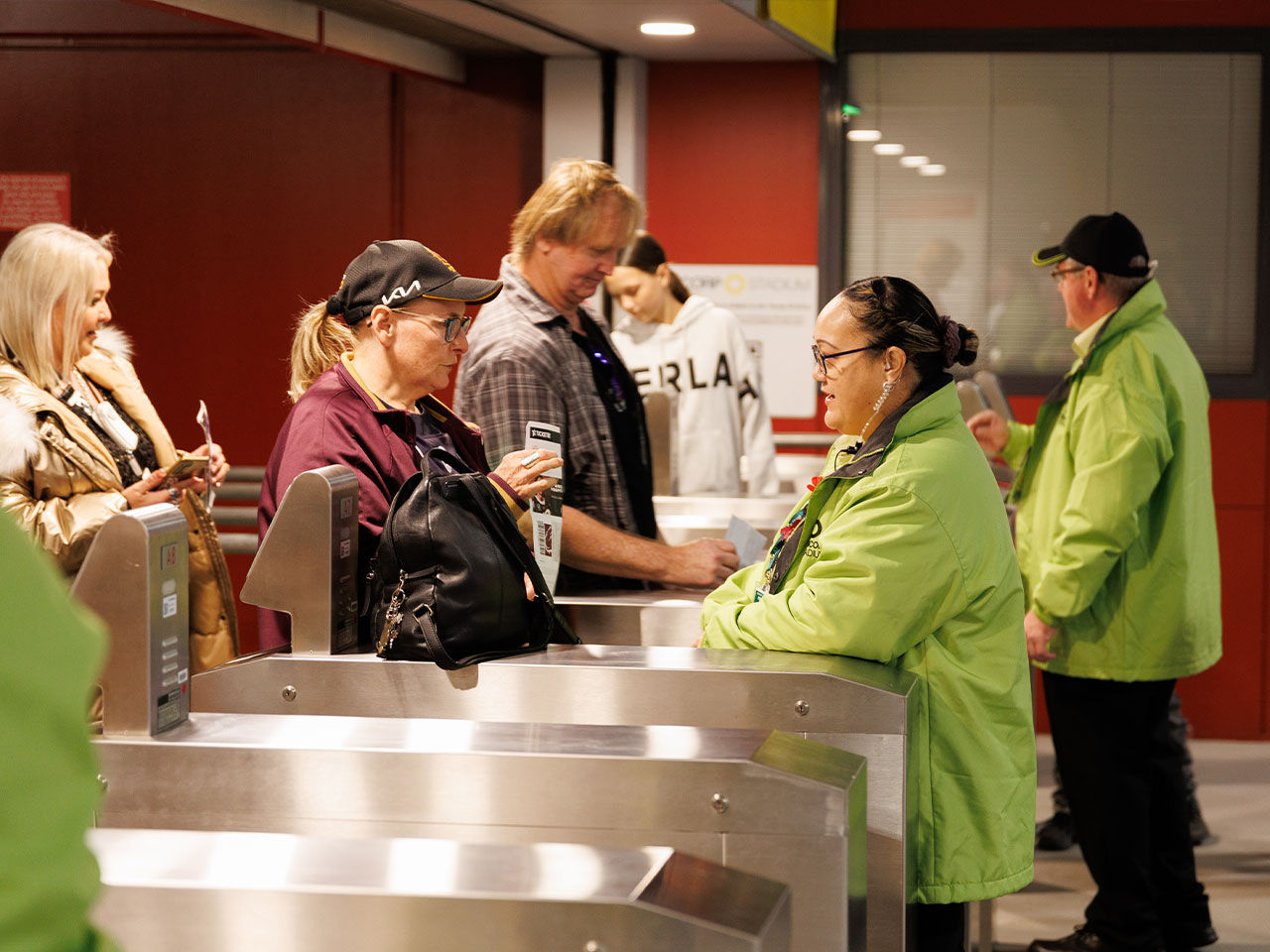 Suncorp Stadium staff member servicing patrons at the Gates.