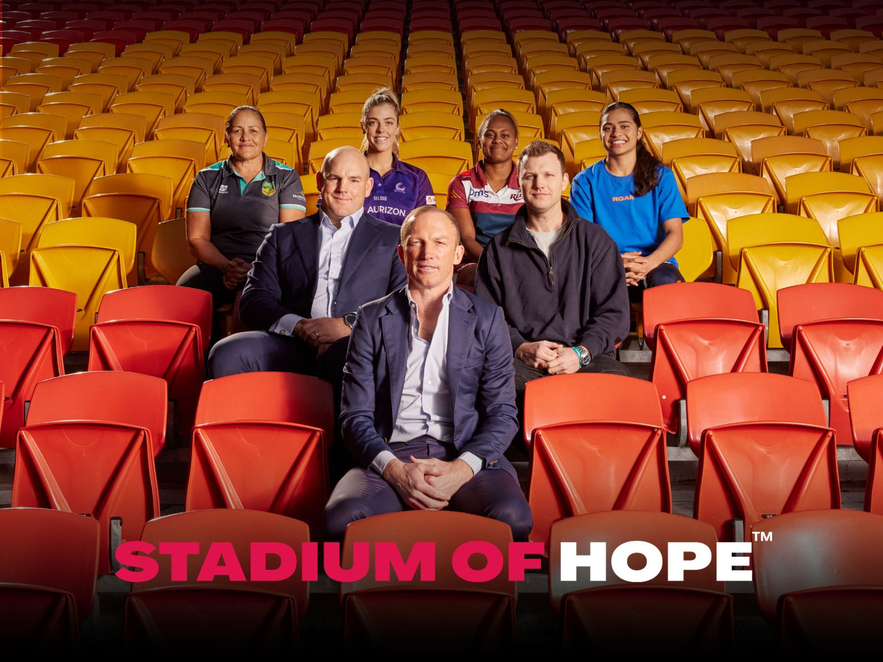 Picture of sporting legends including Darren Lockyer siting in the Suncorp Stadium seats with 'Stadium of Hope' text overlay