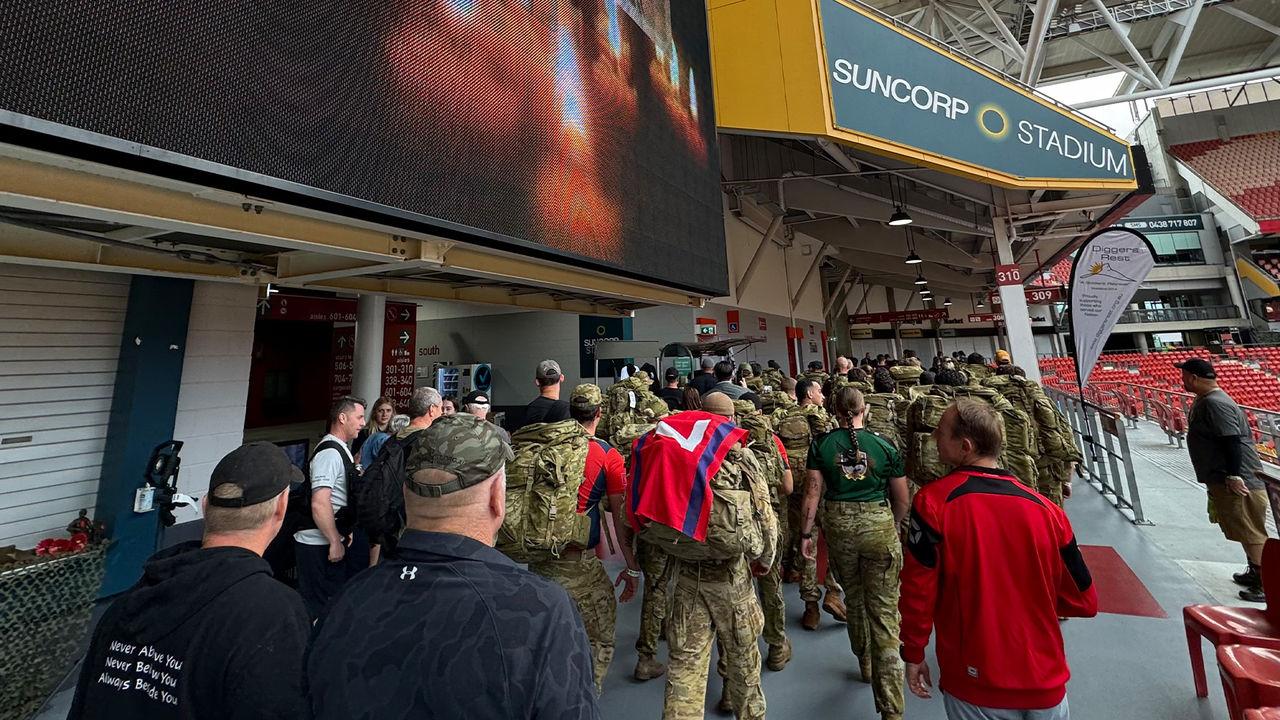 Walkers beginning the 42 Hour Challenge around the Suncorp Stadium concourse