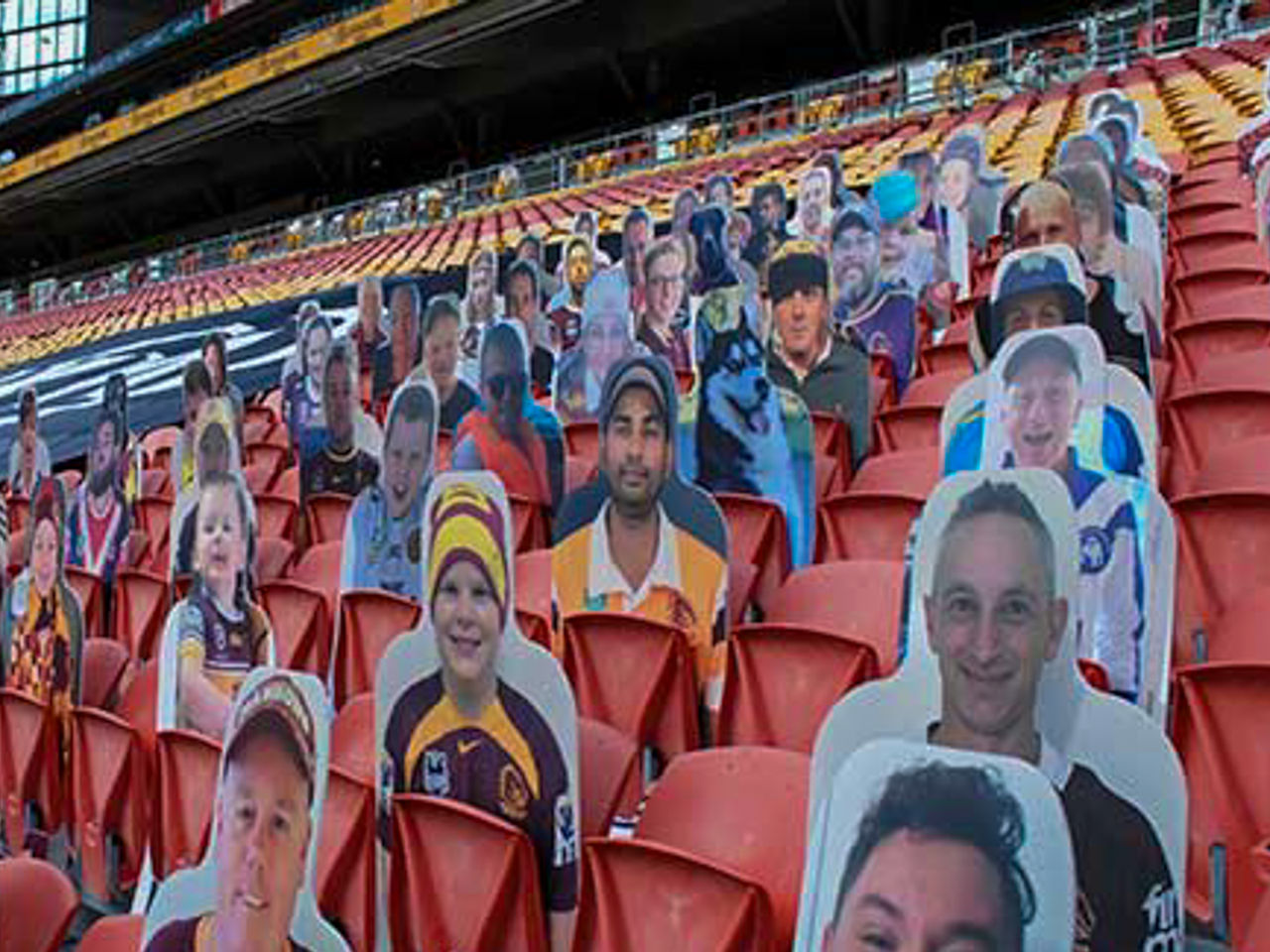 Image of cardboard cutouts of fans sat in the seats at Suncorp Stadium.