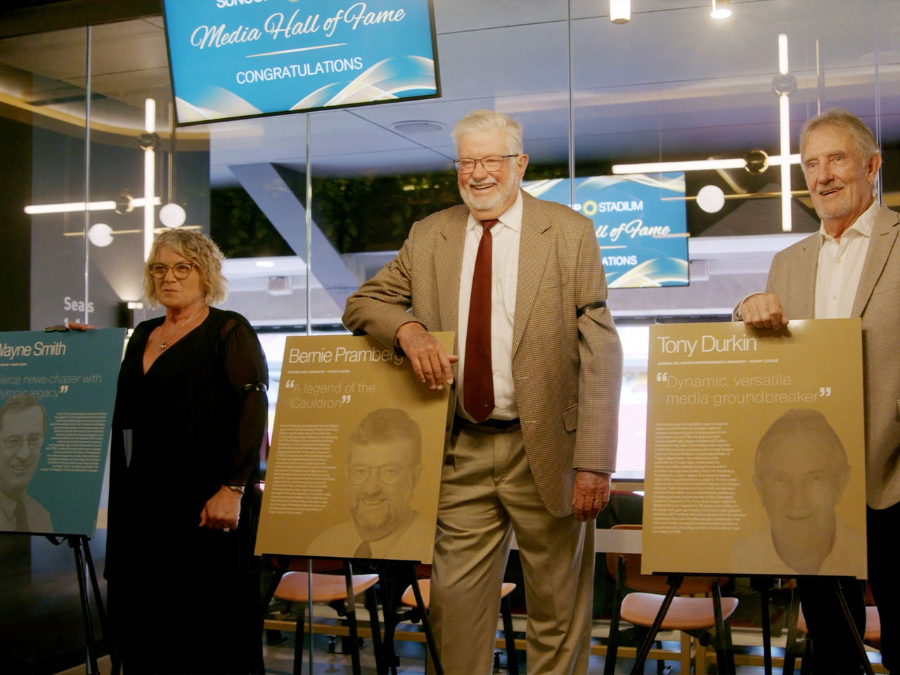 Three recipients stood next to their plaques smiling at the camera. Left to Right: Representative for Wayne Smith, Bernie Pramberg and Tony Durkin.