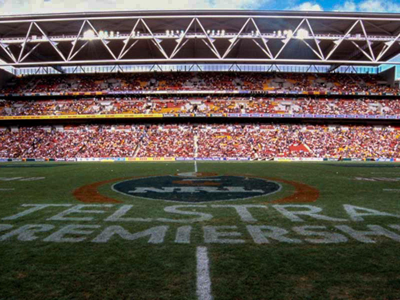 Image of Suncorp Stadium field and seating bowl filled with fans on the first game held at the newly re-developed Suncorp Stadium in 2003.