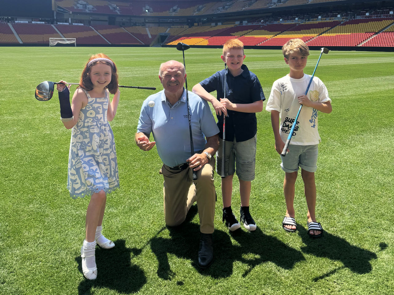 Wally Lewis and kids from Hear and Say