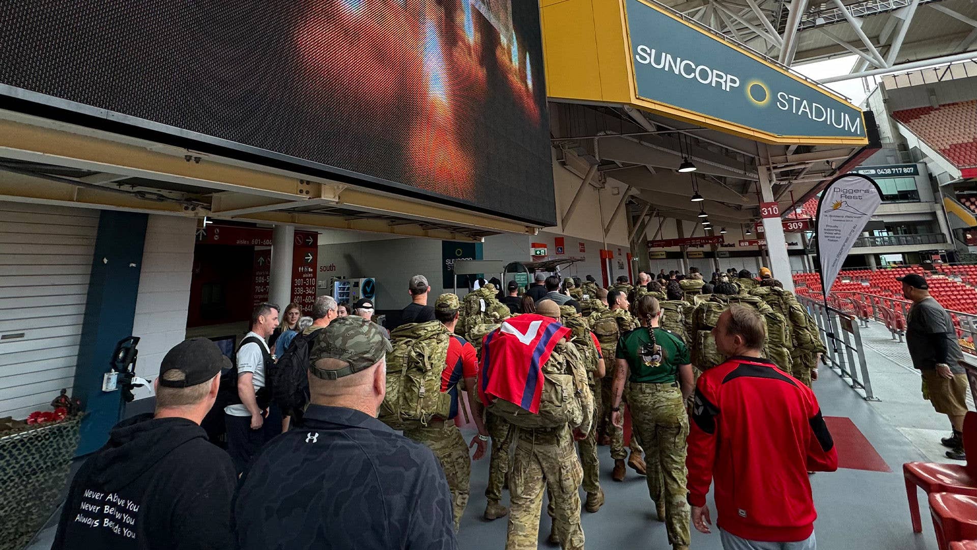 Walkers beginning the 42 Hour Challenge around the Suncorp Stadium concourse