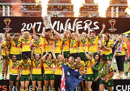 Jillaroos holding up trophy during winning moment.