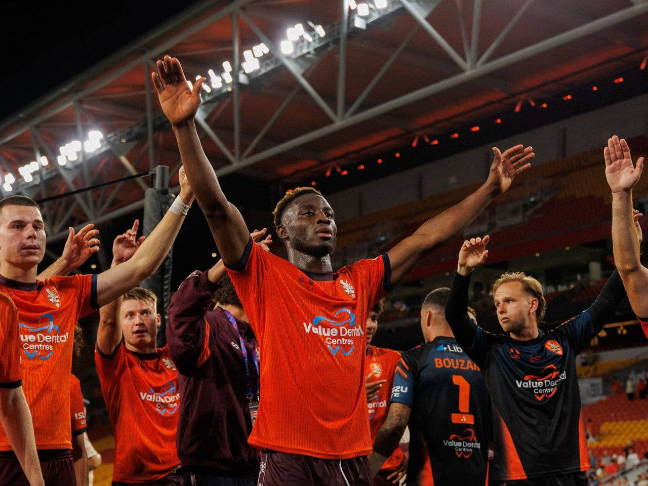 Brisbane Roar Player Hosine Bility clapping to fans
