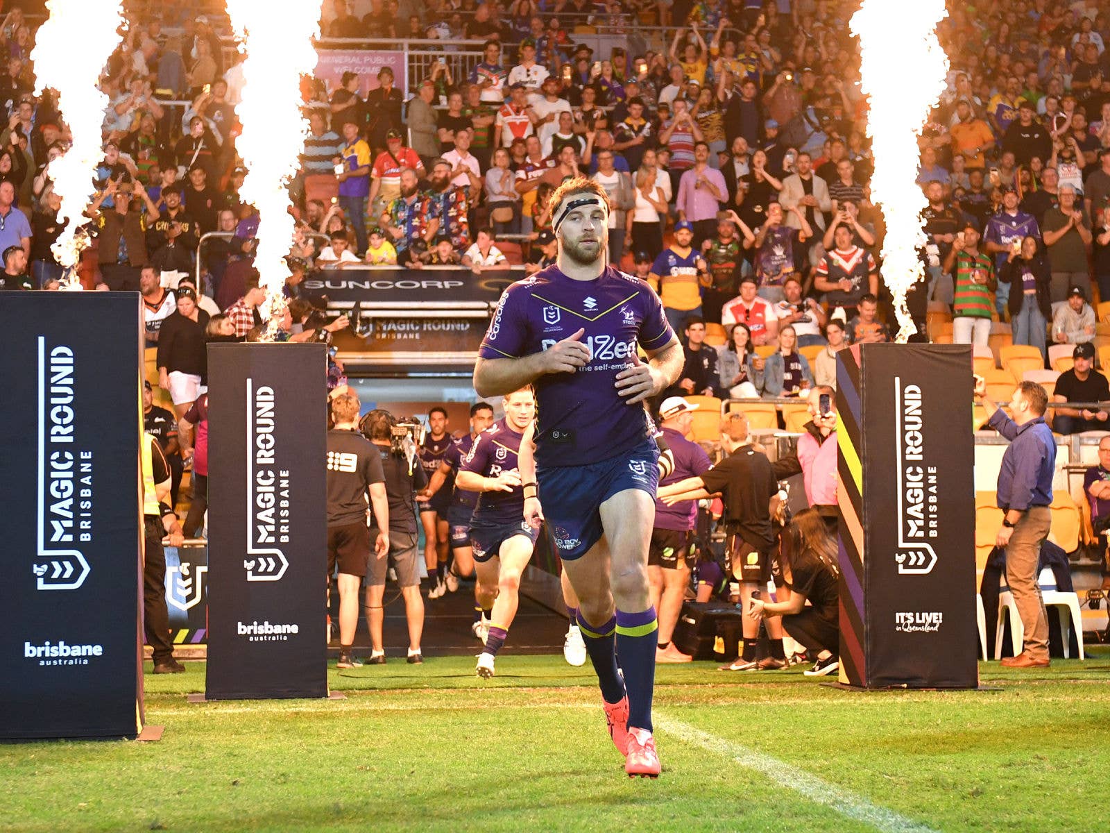 Melbourne Storm players running out of the change rooms