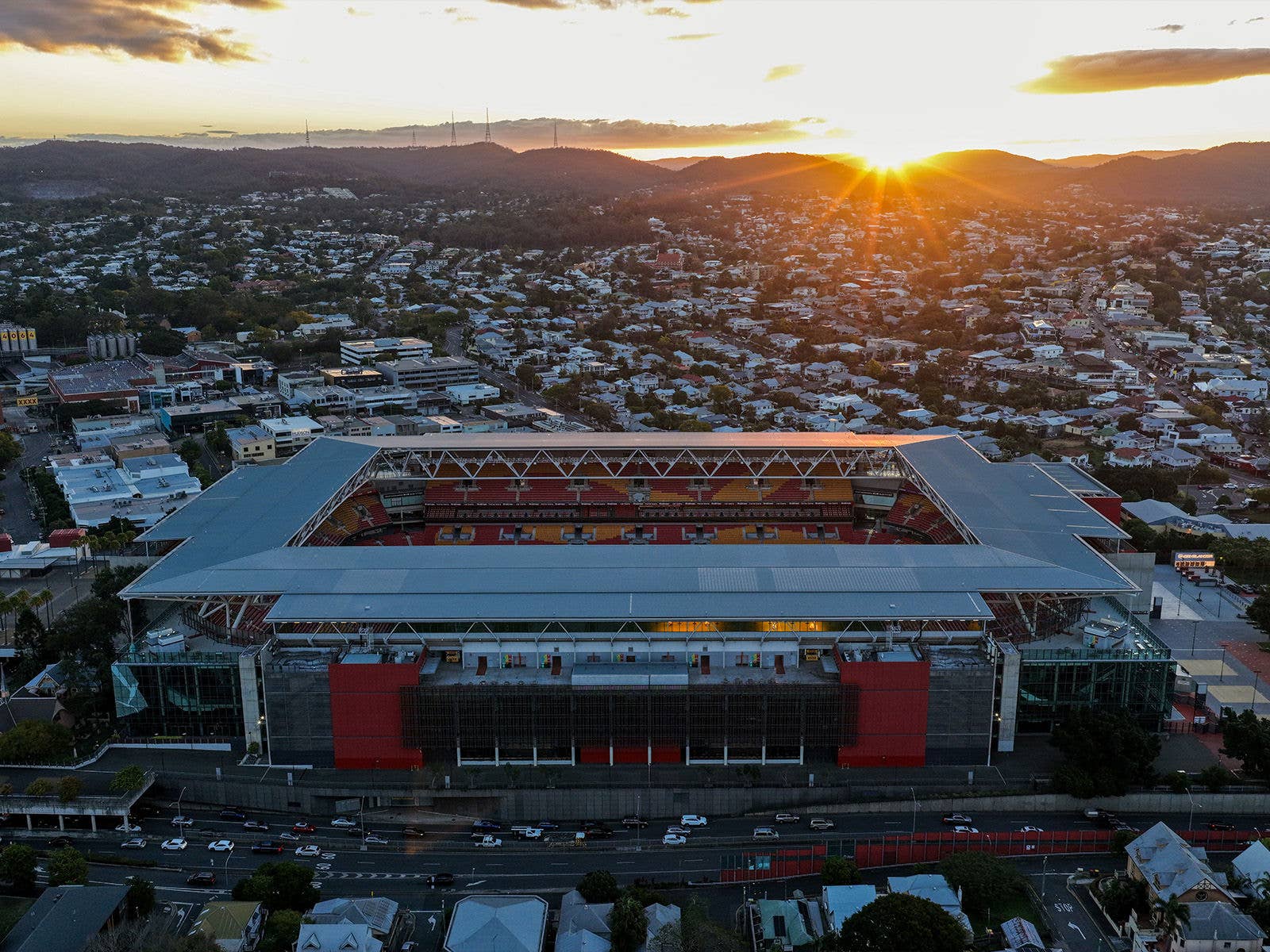 An aerial image looking over Suncorp Stadium and Brisbane City from the East looking West at dusk
