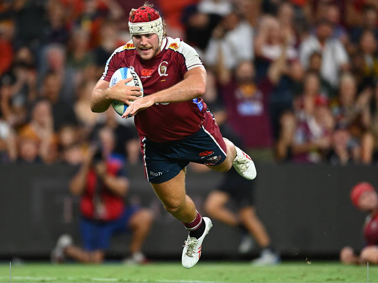 Fraser McReight from the Queensland Reds diving to score a try.