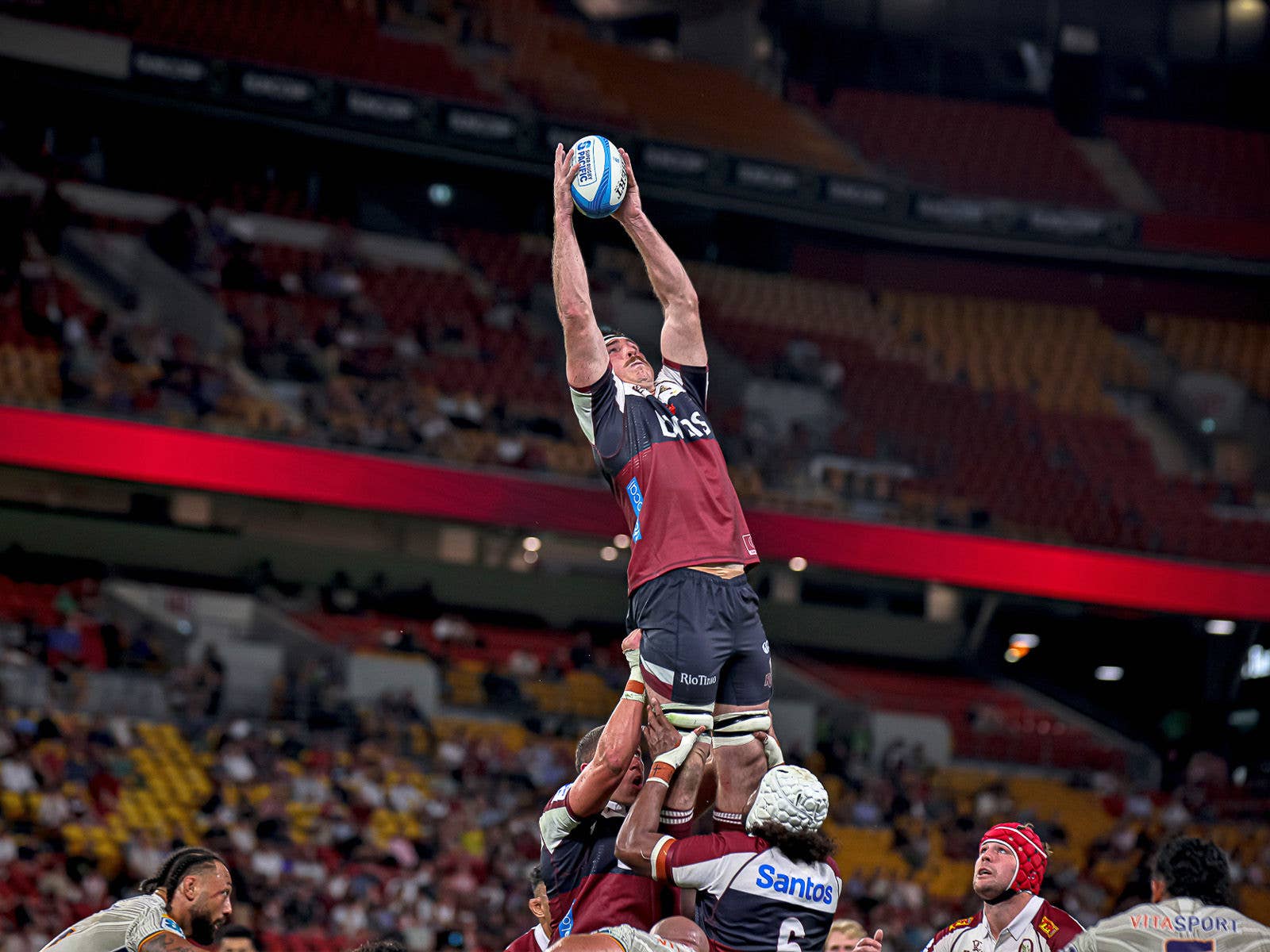 Reds player catching the ball from a scrum