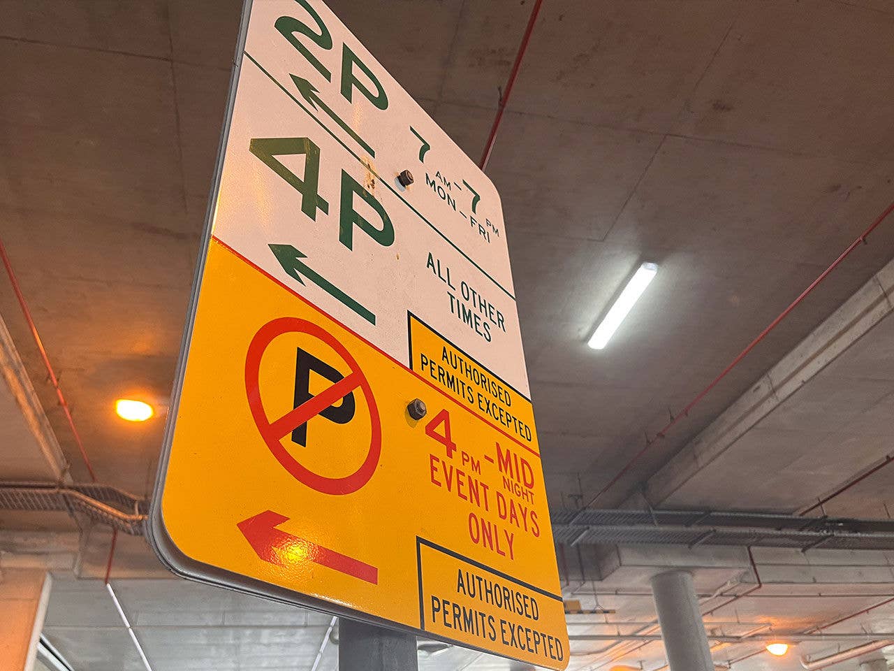 Sign showing parking restrictions on both normal and event days.