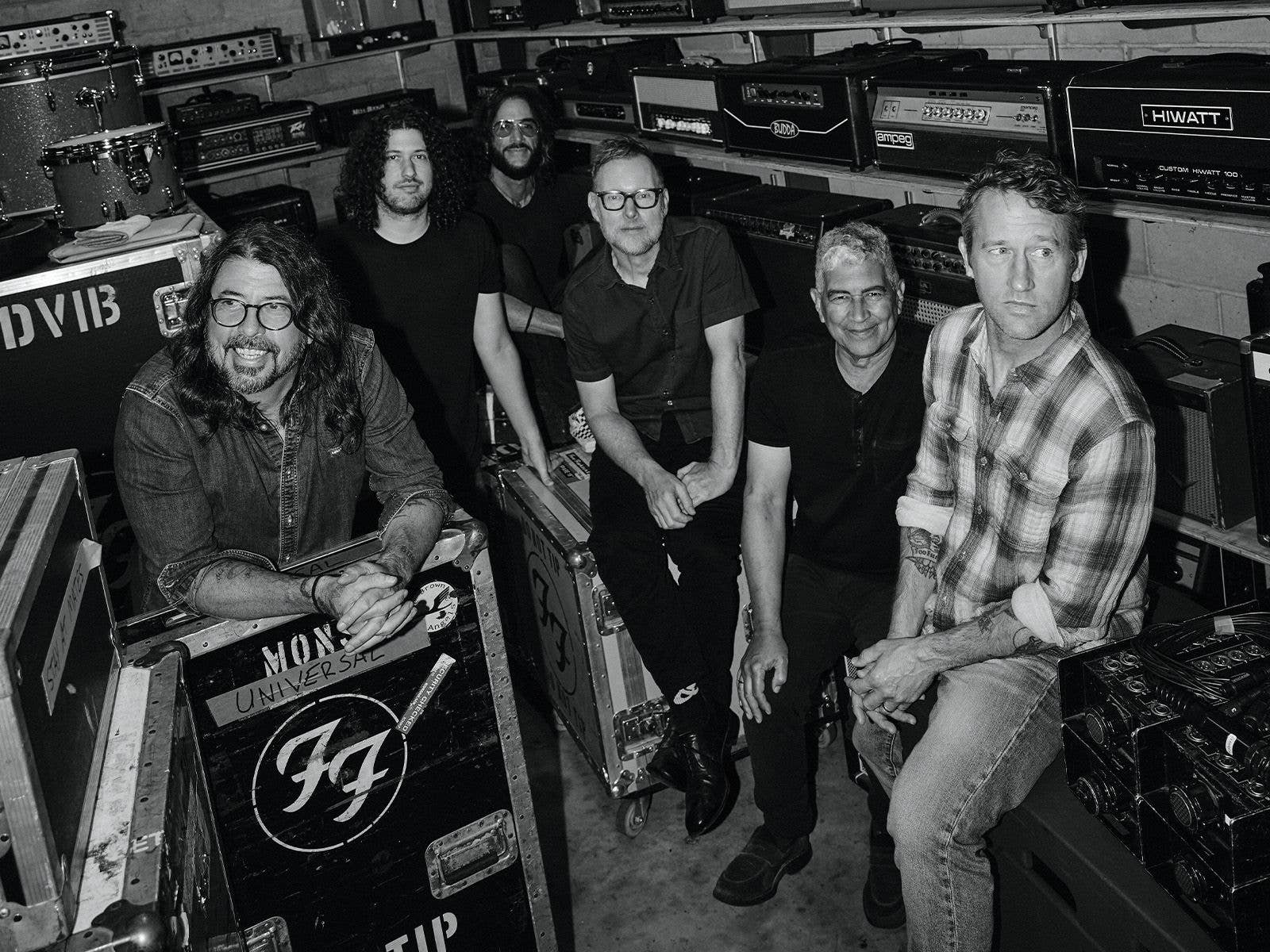 Foo Fighters Black and White Image of the band sitting down and smiling