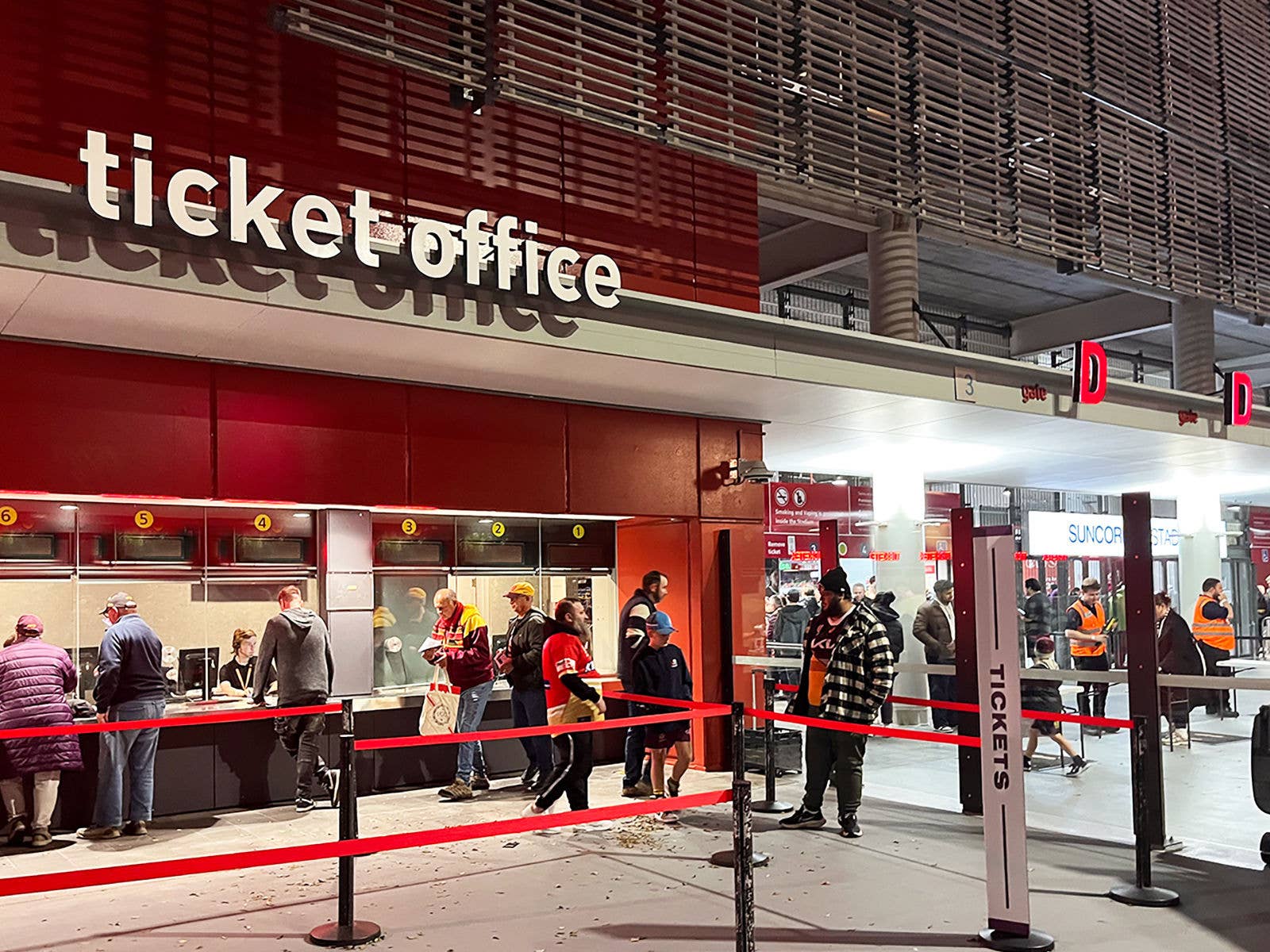 Image of Suncorp Stadium's ticket office. Patrons are at the various windows talking to staff.