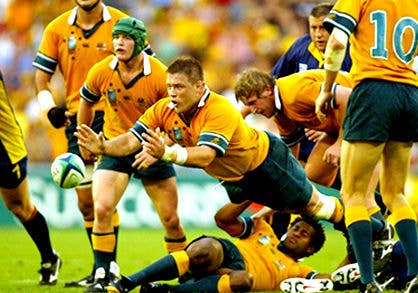 Players mid-game during 2003 Rugby World Cup.