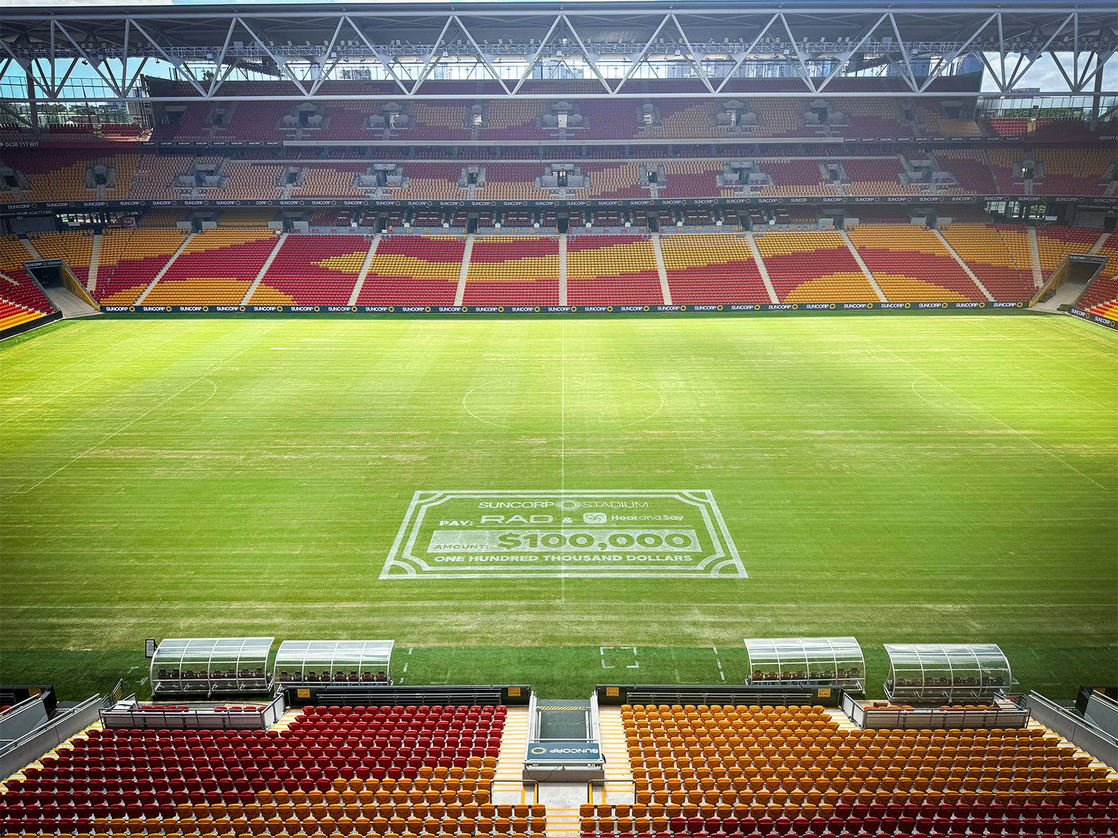 A large white $100000 Cheque painted on the Suncorp Stadium field A large white $100000 Cheque painted on the Suncorp Stadium field