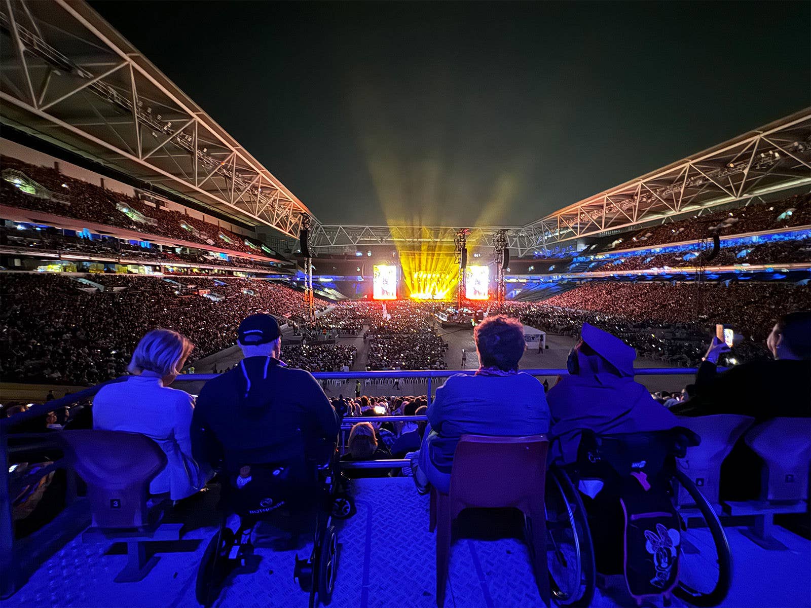 An image of people sitting in PWD seating allocation on Level 3 during a concert at Suncopr Stadium