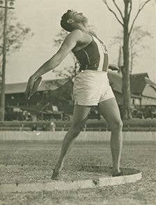 C. O’Neill competing in the discus at Lang Park in the 1920s.