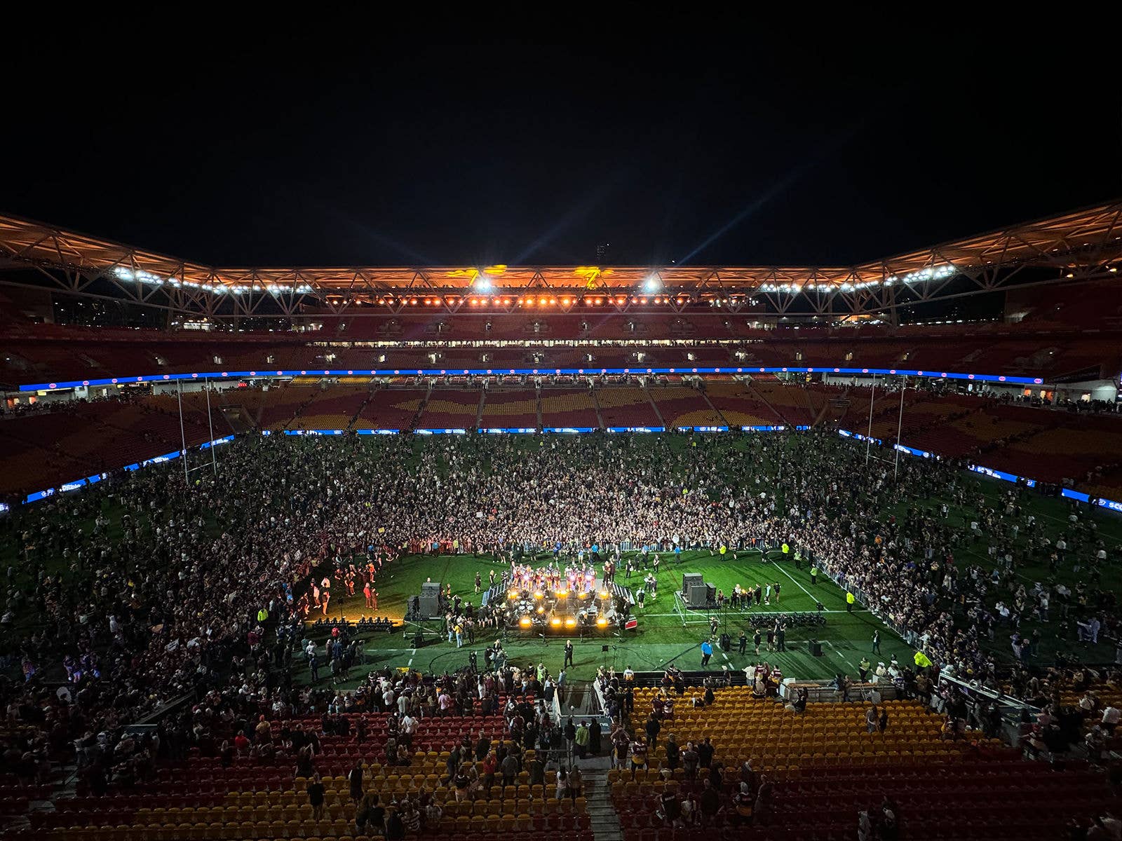 Broncos fans on the field at Suncorp Stadium