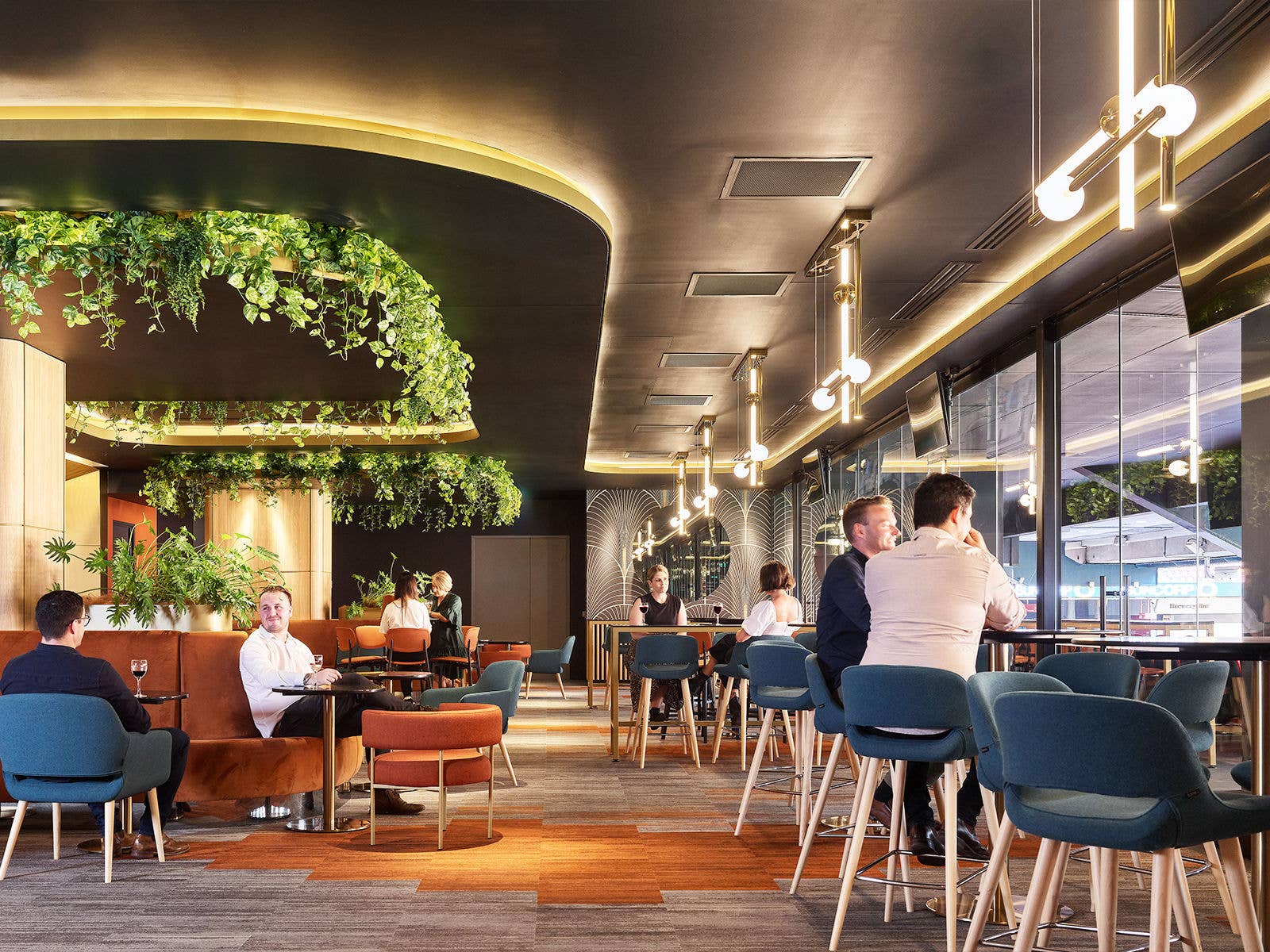 Internal view of The Sunset Lounge. Patrons sat at various tables enjoying an event.