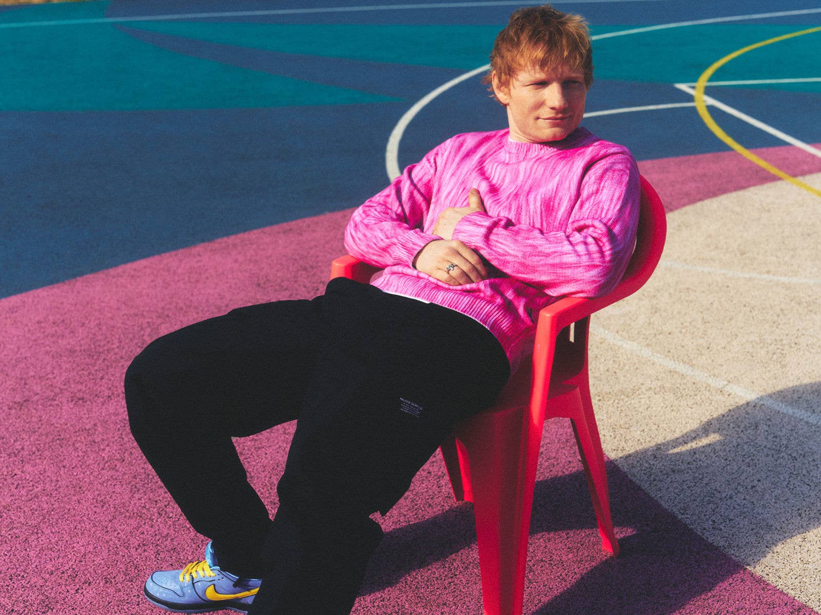 Ed Sheeran sitting on a chair by Petros Studio