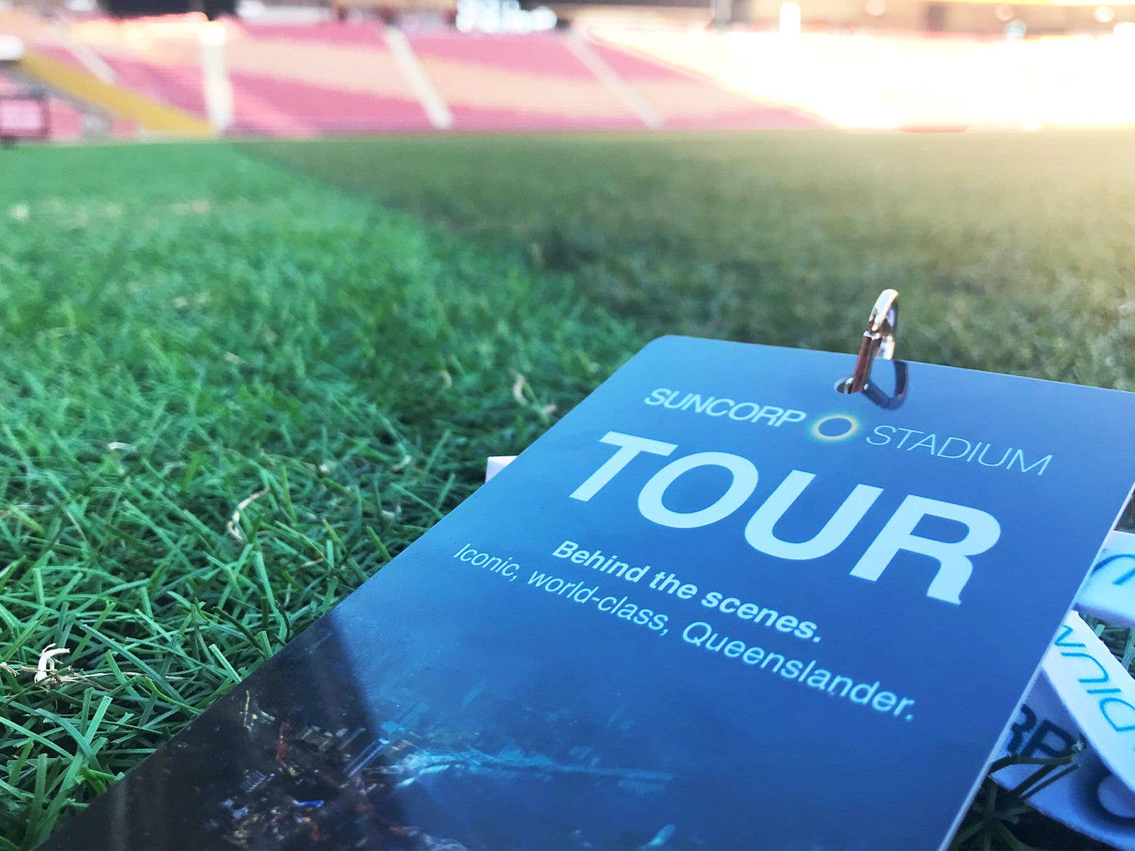 Image of Suncorp Stadium tour lanyard lay on the Suncorp Stadium field.