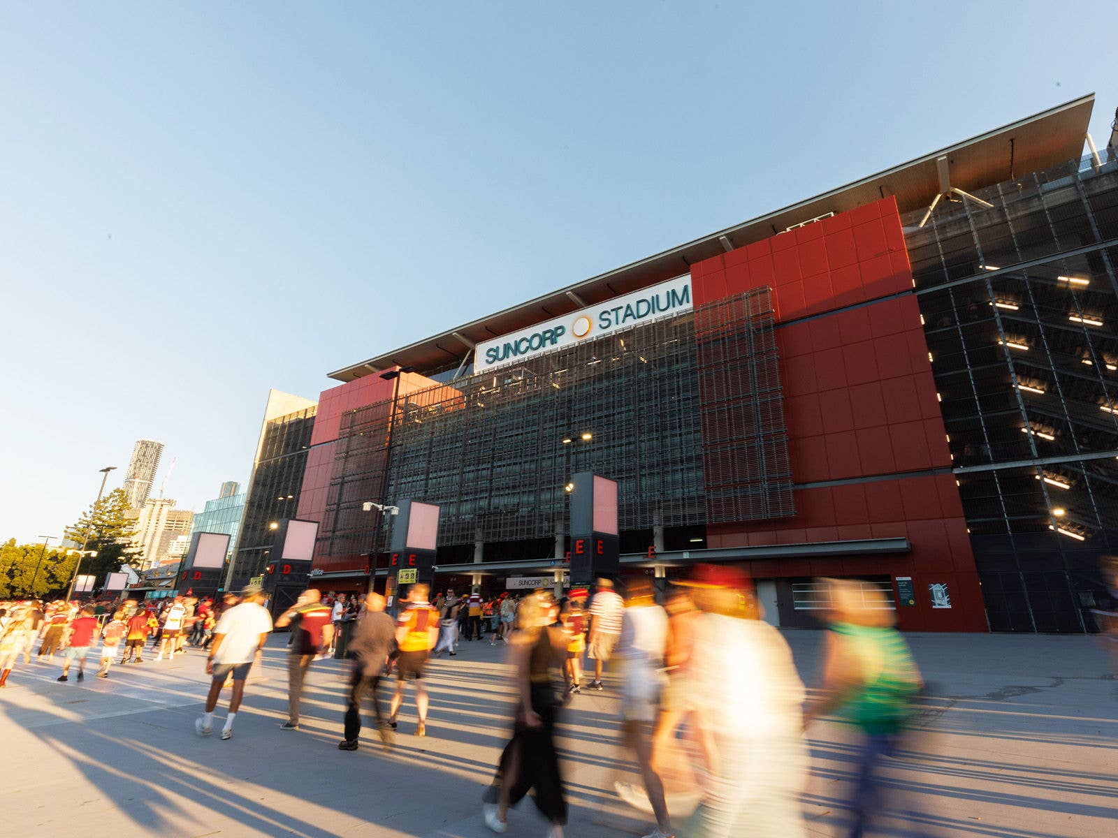 Fans arriving on the Northern side of Suncorp Stadium external plaza near Gate D & E on a sunny day