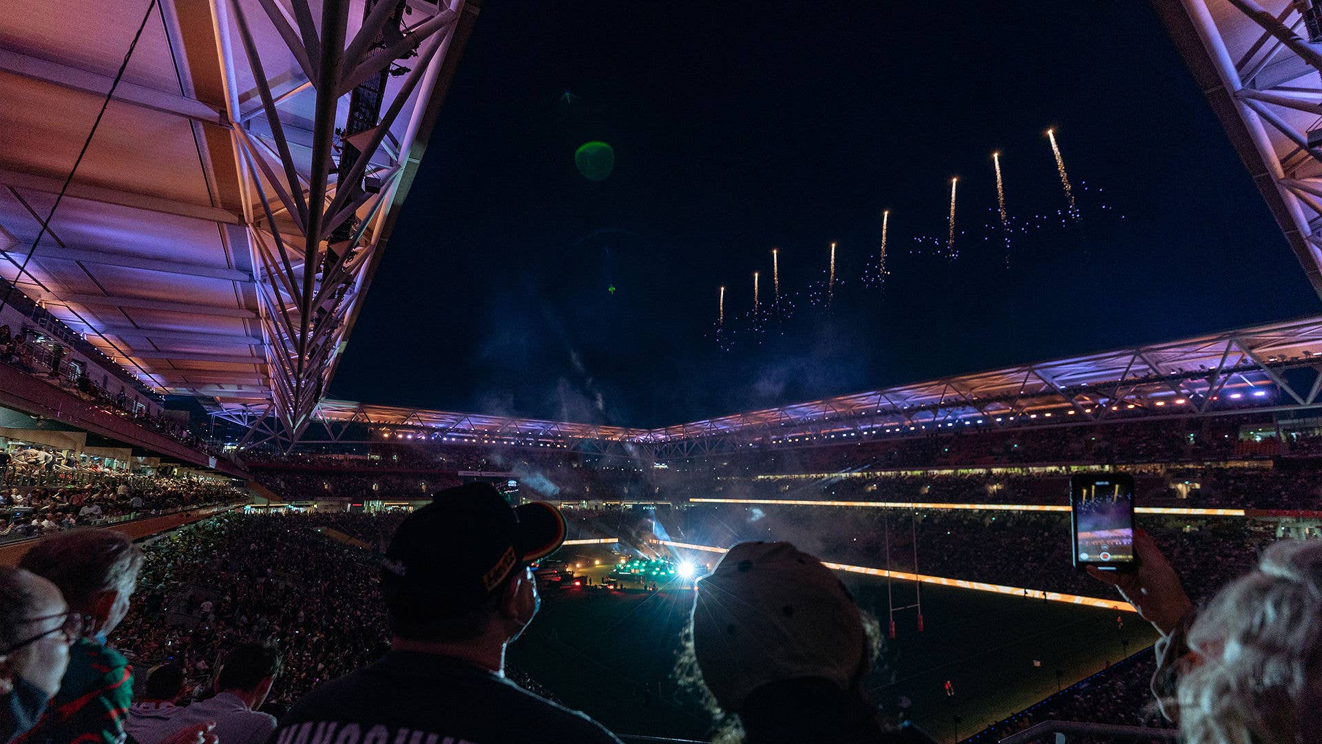 Suncorp lit up at night from inside before an event