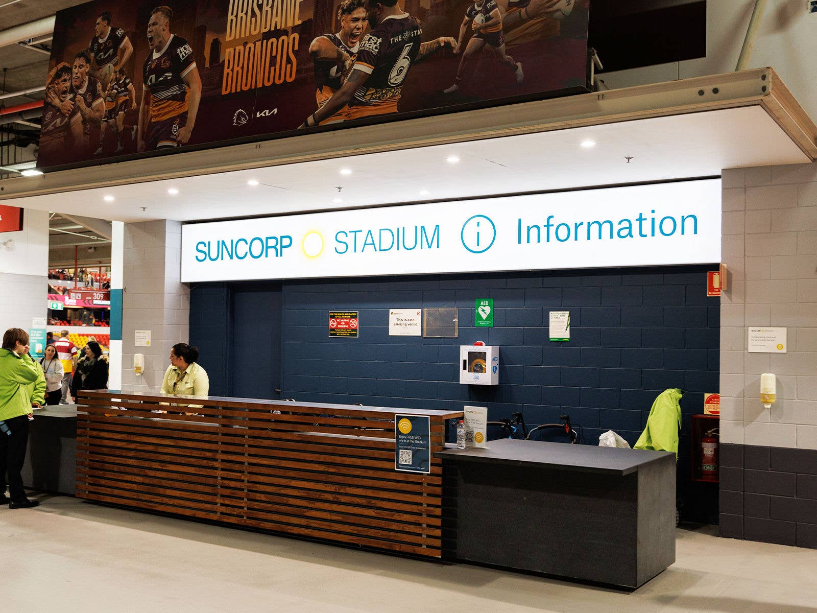 Suncorp Stadium information desk inside the northern gates with staff members attending