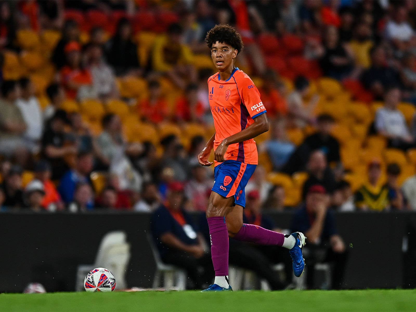 Lucas Herrington has the ball for the Brisbane Roar