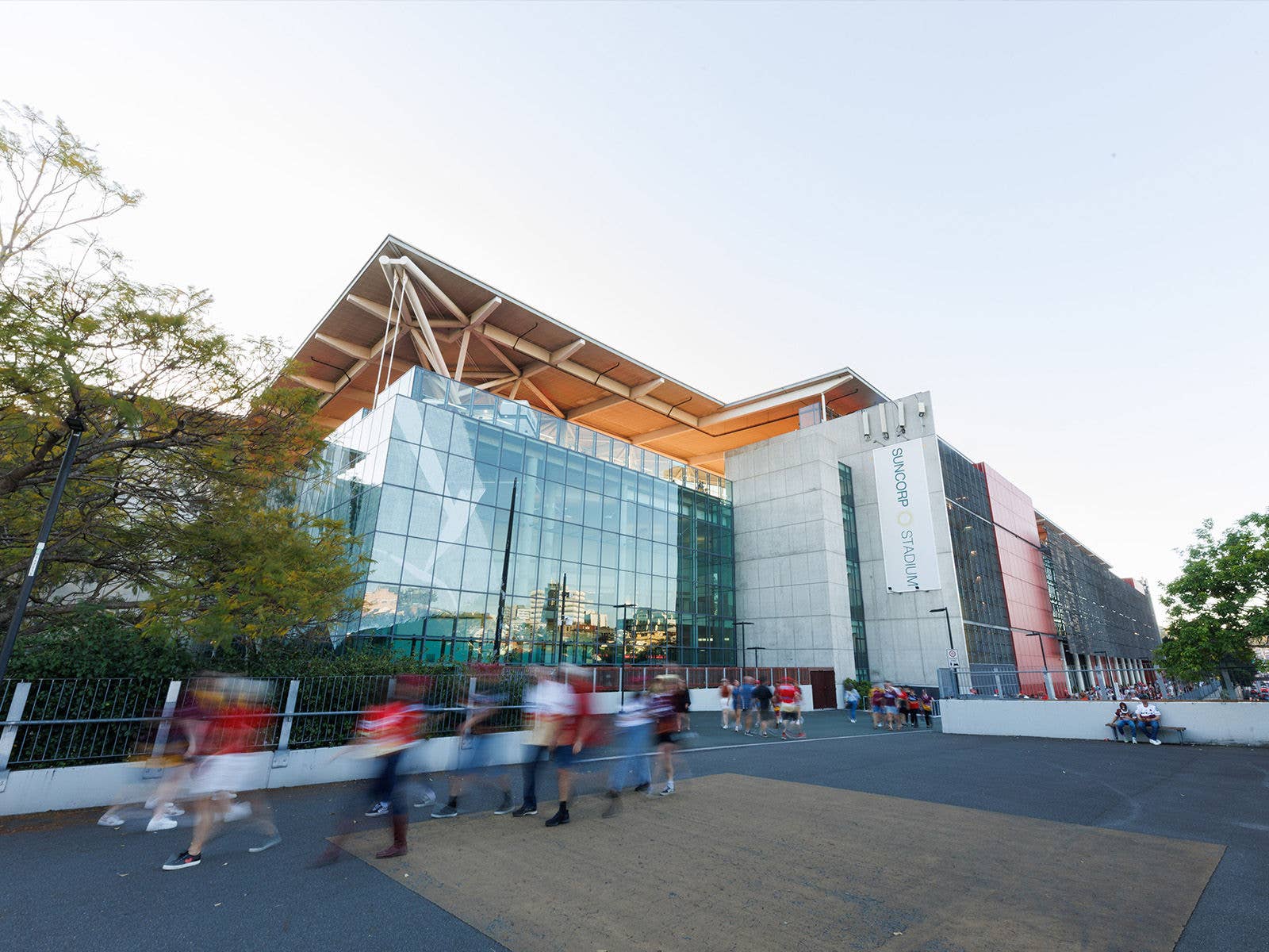 The external south east corner of Suncorp Stadium with people walking around the plaza