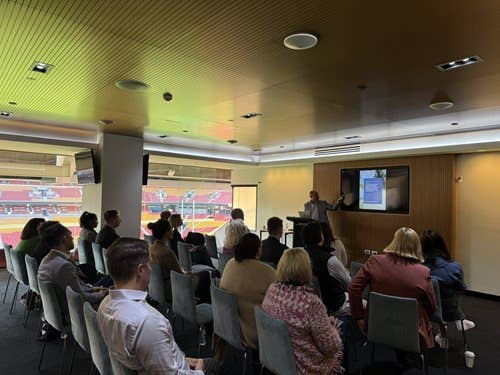 Celebrating NAIDOC Week. Suncorp Stadium team watching a presentation from ASM Global First Nations Ambassador Cameron Costello.