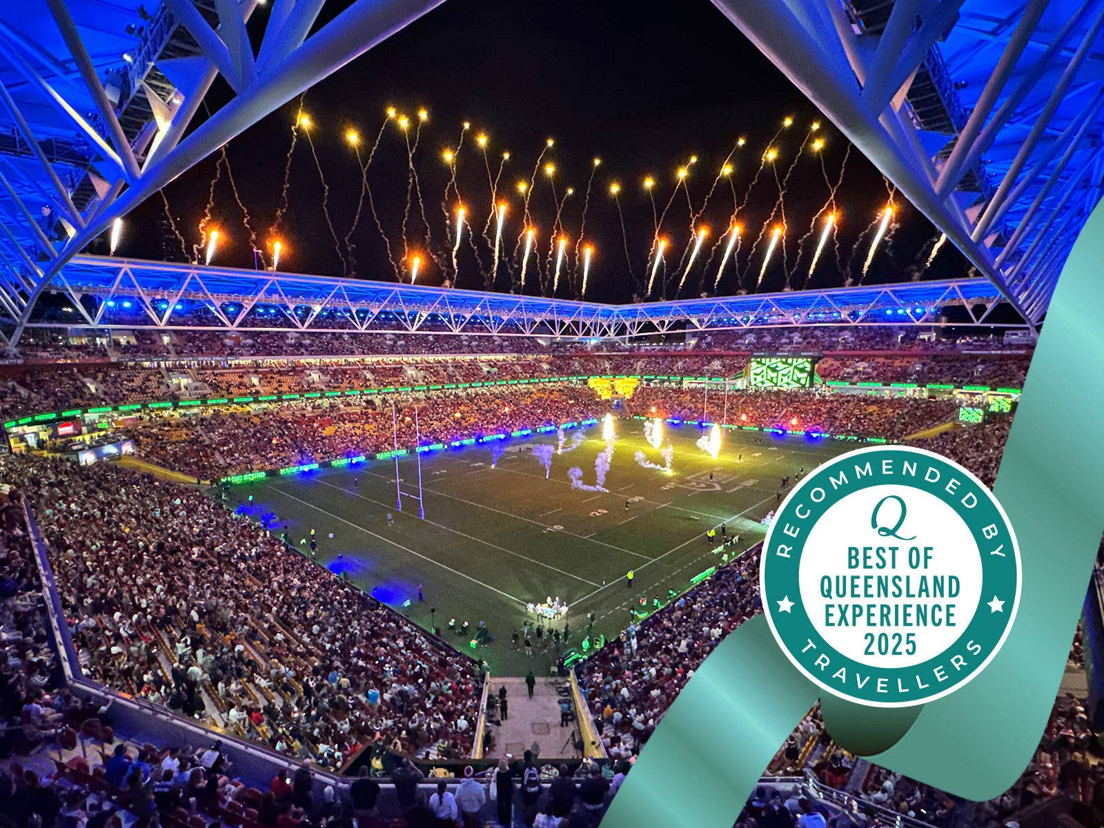 Image of fireworks display over a packed Suncorp Stadium crownd during NRL Magic Round with a badge overlay reading 'BEST OF QUEENSLAND EXPERIENCE 2025' AND 'RECOMMENDED BY TRAVELLERS'