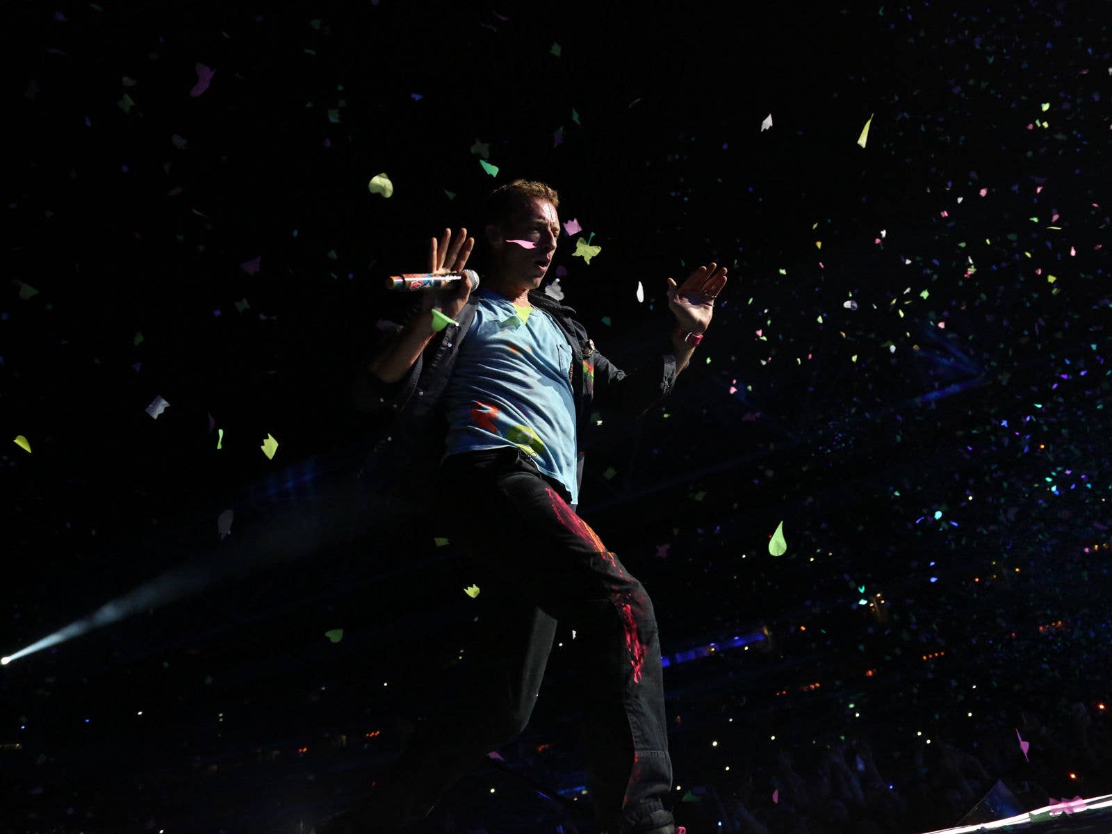 Coldplay on stage at Suncorp Stadium during their Mylo Xyloto Tour in 2012.