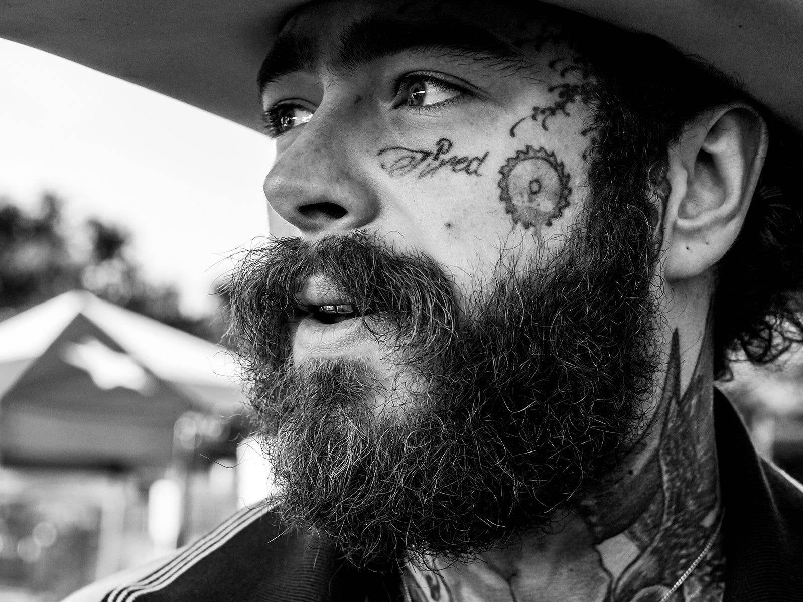 A close up image of Post Malone's face
