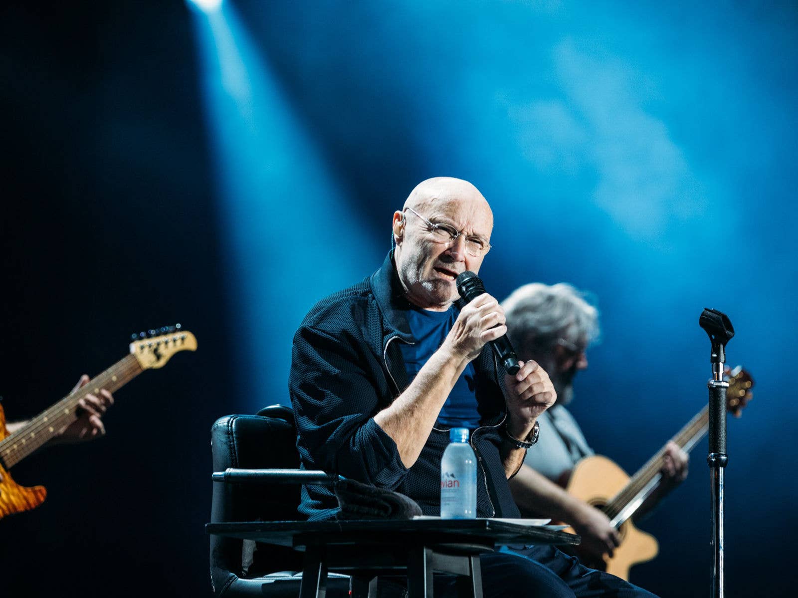 Phil Collins on stage at Suncorp Stadium during his I'm Not Dead Yet Tour in 2019.