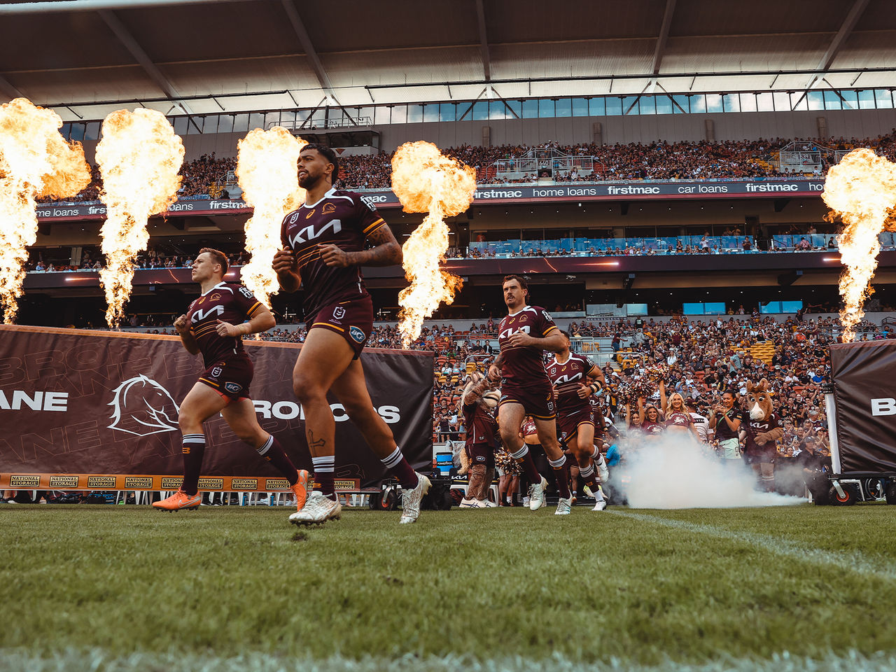 Brisbane Broncos run out onto Suncorp Stadium