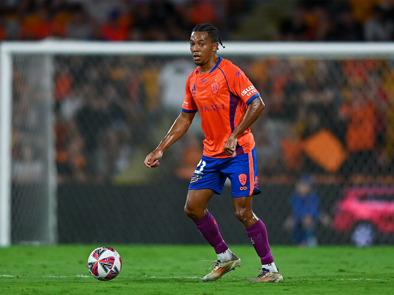 Antonee Burke-Gilroy looks to clear for the Brisbane Roar