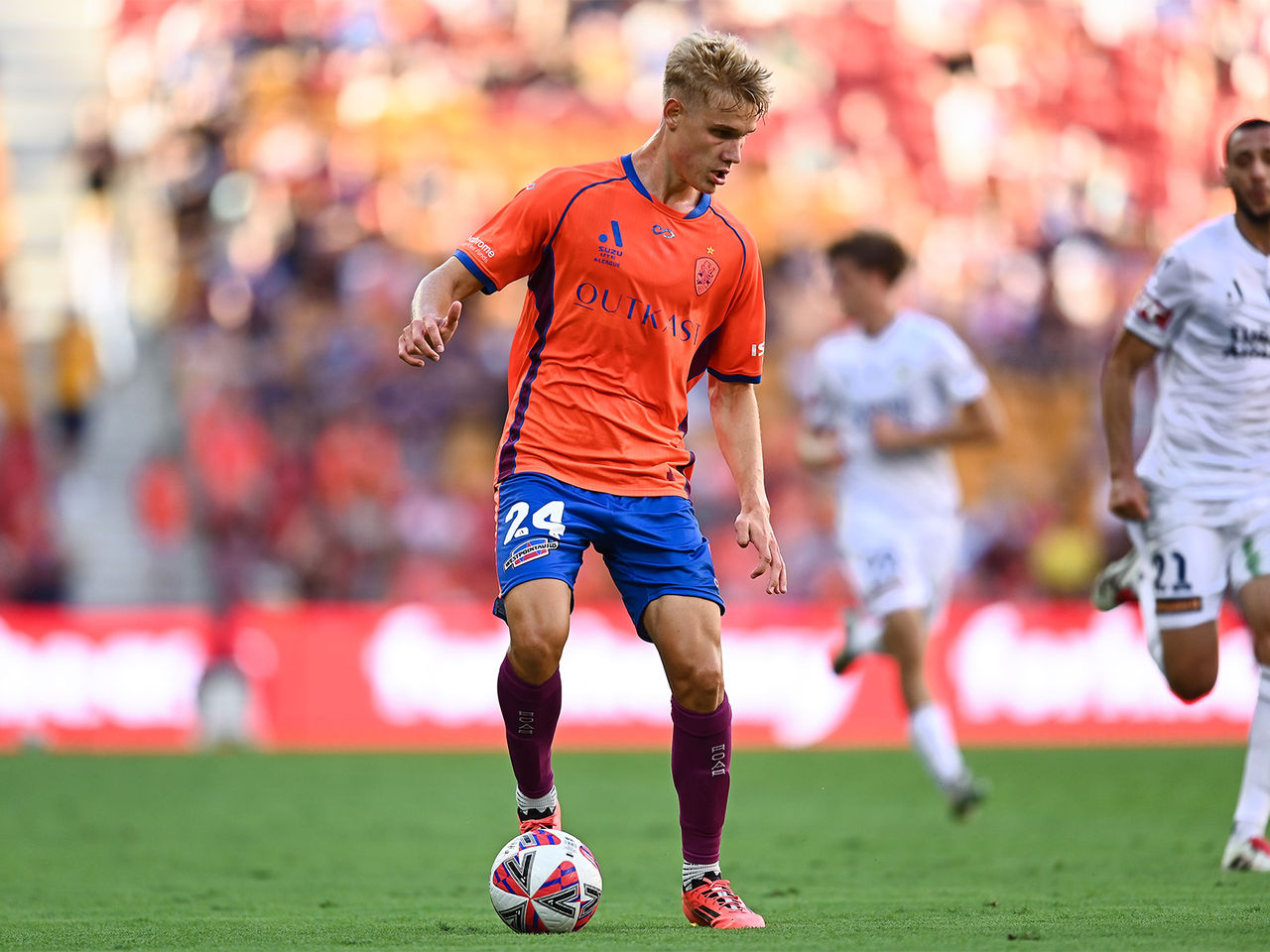 Sam Klein with the ball for the Brisbane Roar