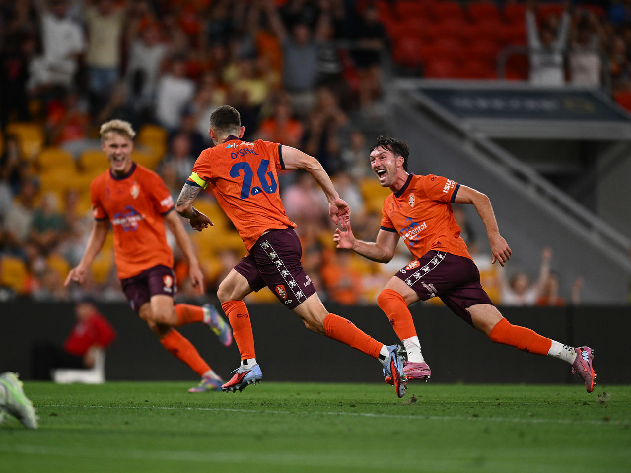 Brisbane Roar Players running and celebrating