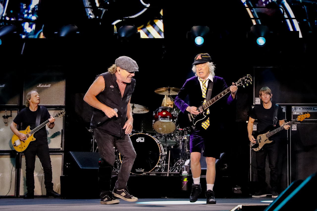 An image of two ACDC band members on stage together