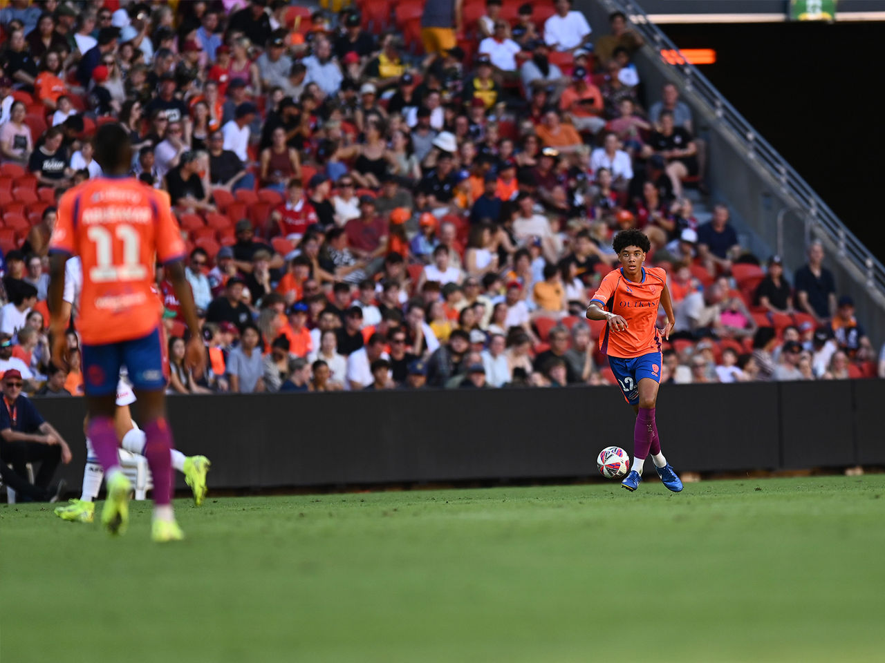 Lucas Herrington with the ball for the Brisbane Roar
