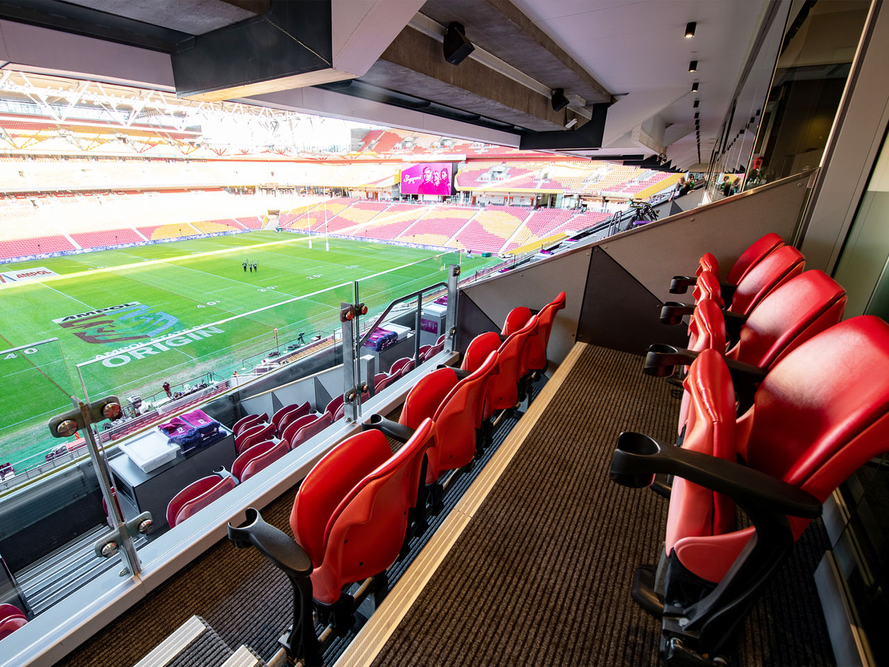 Seating in Annual Suite with view of Suncorp Stadium's field.