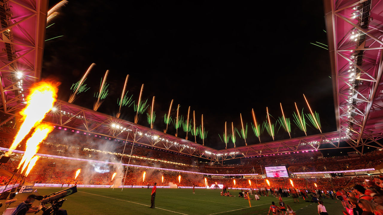 Fireworks and flames light up the night sky at Suncorp Stadium at the end of a NRL game as part of Brisbane Riverfire